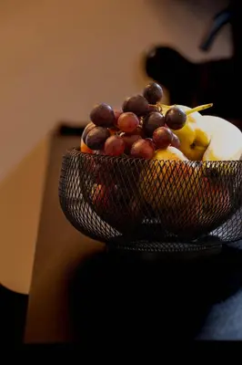 a bowl of fruit sitting on top of a table at Laubennest 1 in Merano