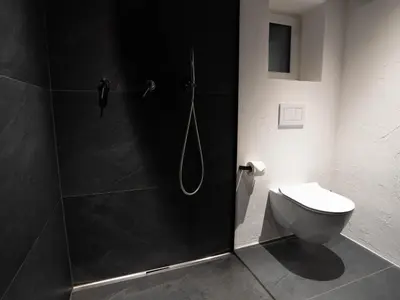 a bathroom with a shower and a toilet at Laubennest 1 in Merano