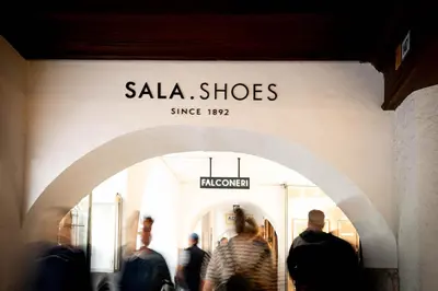 a group of people walking in front of a store at Laubennest 1 in Merano
