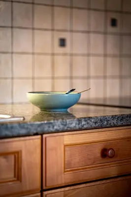 a bowl sitting on top of a counter in a kitchen at Traditional Cozy Apartment in Tirolo