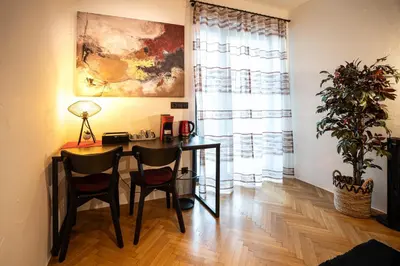 a dining room with a table and two chairs at Laubennest 2 in Merano