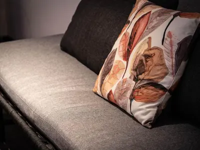 a pillow sitting on top of a couch at Laubennest 2 in Merano