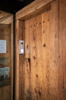 a wooden wall with a phone on it at Laubennest 2 in Merano