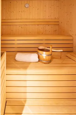 a sauna with a wooden tub and a towel at Laubennest 3 in Merano