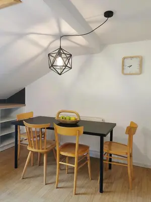 a dining room with a black table and chairs at Haus Maria in Campolasta