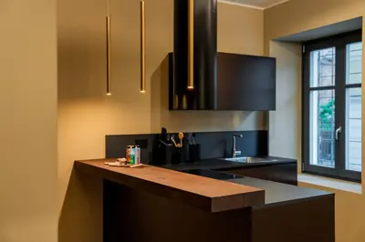 a kitchen with a counter top and a sink at KODERLE SUITE K1 Bucaneve in Brunico