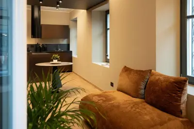 a living room with a couch and a table at KODERLE SUITE K1 Bucaneve in Brunico