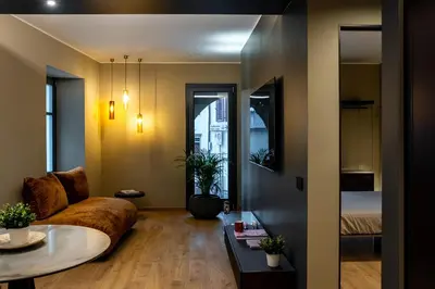 a living room with a couch and a table at KODERLE SUITE K1 Bucaneve in Brunico