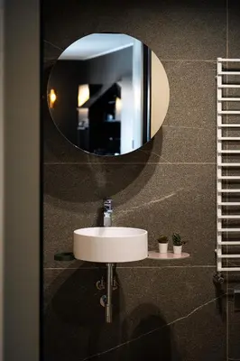 a bathroom with a sink and a mirror at KODERLE SUITE K4 Zampa D Orso in Brunico
