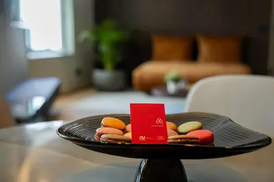 a plate with cookies and a red card on a table at KODERLE SUITE K4 Zampa D Orso in Brunico