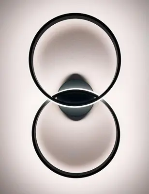a black object sitting on a white background at Studio Cervus with BrixenCard in Bressanone