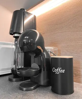 a coffee maker sitting on a counter with a cup at Studio Cervus with BrixenCard in Bressanone