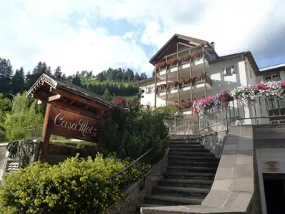 a building with stairs in front of a building at Gianni's Home2 Santa Cristina VG in Santa Cristina in Val Gardena