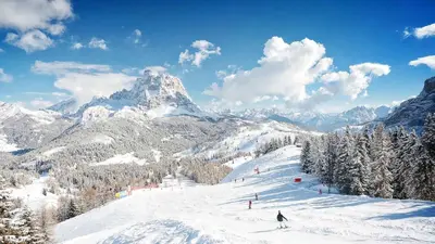 a person skiing down a snow covered mountain at Tabia del Caser in San Tomaso