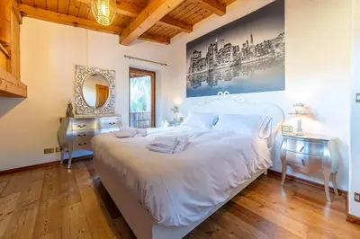 a living room with a couch and a table at Altèra Home in Rocca Pietore