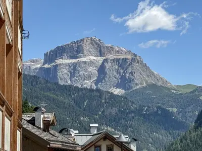 a mountain in the middle of a town with houses at Appartamento Anna in Campestrin