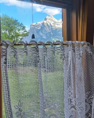 a window with a view of a mountain at Casa Cecilia Dolomiti - scenic views, pets welcome in Piaia