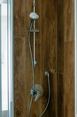 a bathroom with a sink and a washing machine at Ciasa Silvano 1721 SV in Falcade