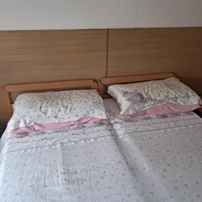 two beds sitting next to each other in a bedroom at Villa Cecilia mono in Tonadico