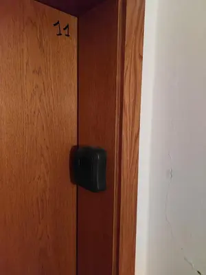 a wooden door with the number on it at Carezza Lake Apartment in Carezza al Lago