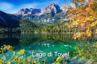 a view of a lake with mountains in the background at Agritur Gioia in Sanzeno