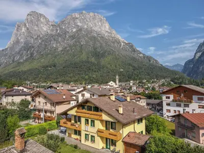 a village with a mountain in the background at Casa Serena in Dolomiti Agordine in Taibon