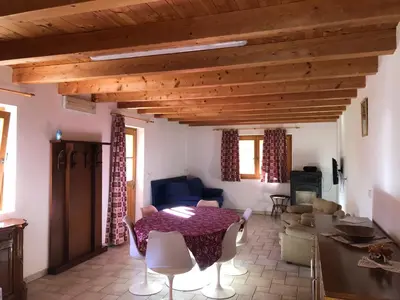 a living room with a table and a couch at B&B del Mazarol in Canale San Bovo