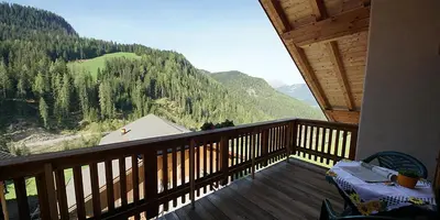 a balcony with a view of a mountain at Wirthof in La Valle