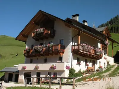 a building with flower boxes and balconies on it at Wirthof in La Valle