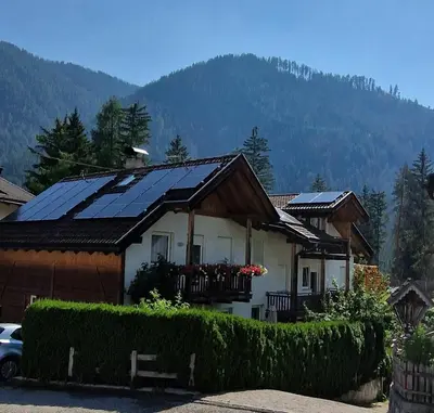 a house with solar panels on top of it at Ciasa Rungger in San Martino in Badia