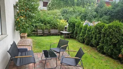 a group of chairs sitting on a patio at Ciasa Rungger in San Martino in Badia