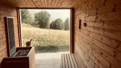 a room with a large window in a wooden wall at Appartamento Stella Alpina con sauna piscina palestra e posto auto in Cavalese