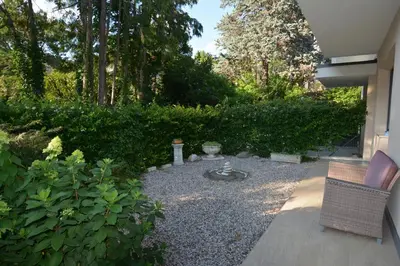 a garden with a fire pit in a yard at maia garden - apartment & private garden in Merano