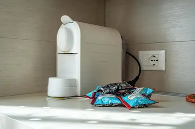 a counter top with a toaster and chips on it at Dimora Kino, Taio Ospitar in Taio