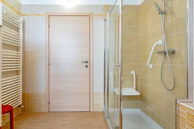 a bathroom with a shower and a toilet at Dimora Kino, Taio Ospitar in Taio