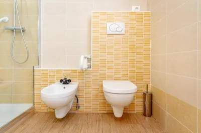 a bathroom with a toilet and a sink and a shower at Dimora Kino, Taio Ospitar in Taio