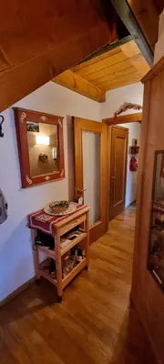 a large room with a table and a couch at Pelmo retreat in Villanova