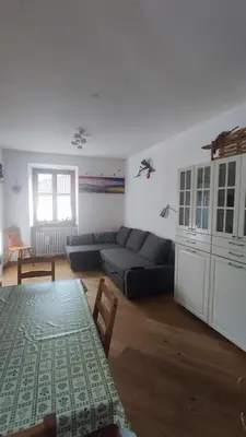 a living room with a couch and a table at Riccarden Cavalese Centro in Cavalese