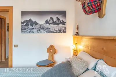 a living room with a couch and a table at Dolympic View Cortina in Cortina dʼAmpezzo