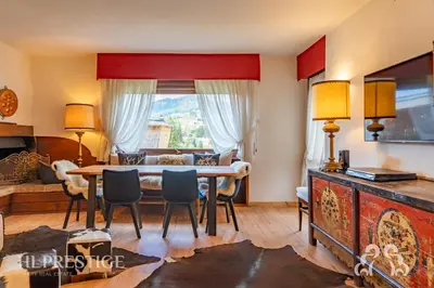 a bedroom with a bunk bed and a window at Cà di Bosco Cortina in Cortina dʼAmpezzo