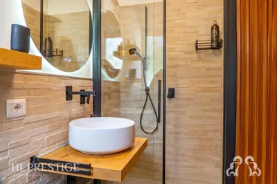 a bathroom with a sink and a shower at Olimpic Cà di Bosco in Cortina dʼAmpezzo