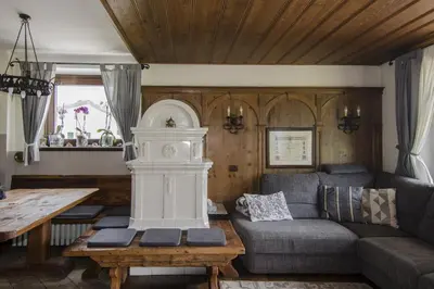 a living room with a couch and a table at Panoramico su Cortina in Cortina dʼAmpezzo