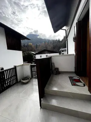 a balcony with a view of a mountain at La Tana di Giò in Forno di Zoldo
