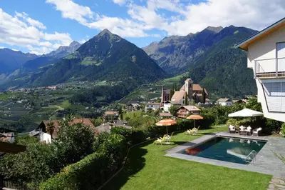 a villa with a view of the mountains at Apartment Prairerhof in Schenna