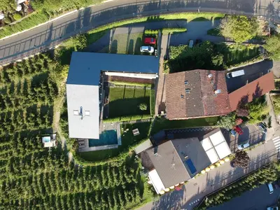 an aerial view of a house with a river at Apartment Prairerhof in Schenna