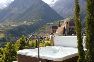 a bath tub with a view of a mountain at Apartment Prairerhof in Schenna