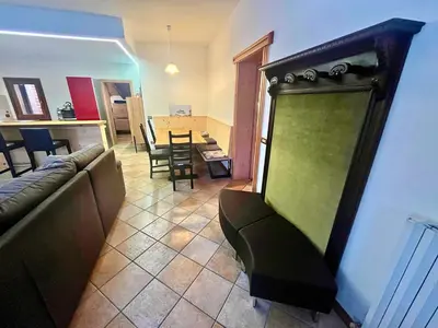 a living room with a couch and a table at Relax & Elegance apartment near Cortina in San Vito di Cadore