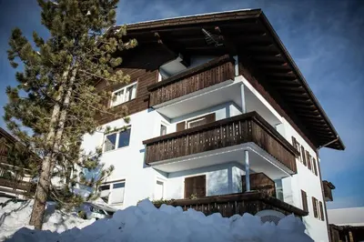 a building with snow in front of it at Nock Apartment Dolomites in South Tyrol - Italy in Nova Ponente