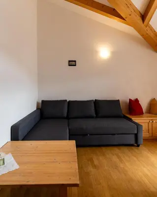 a living room with a couch and a table at El Casel dei Masi in Grumes