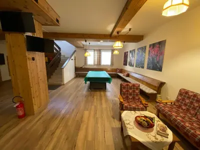 a living room with a couch and a table at Residence Canazei in Alba di Canazei